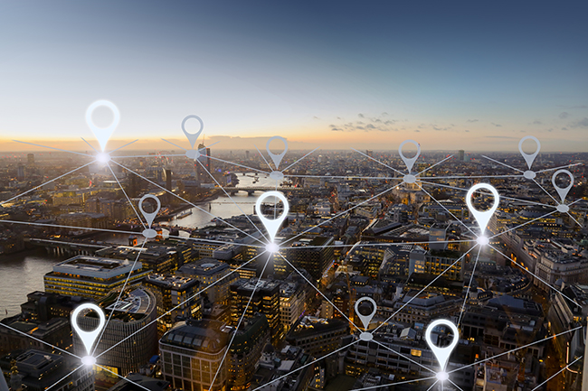 Geo-fencing map with location pins across a connected city skyline